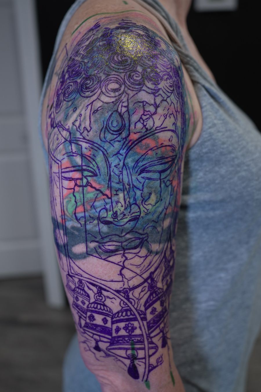 Cover-up tattoo stencil placement on the upper arm