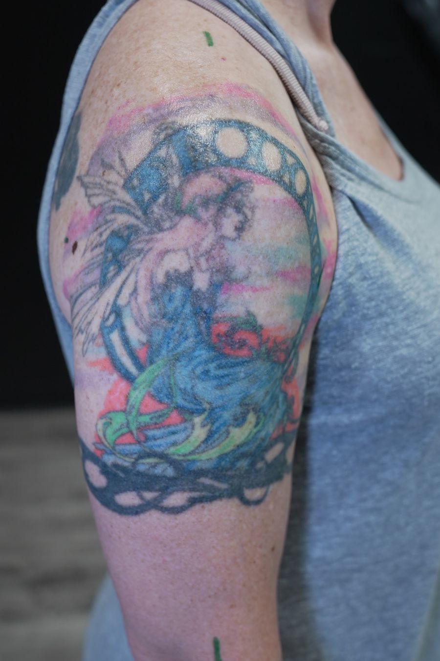 Original shoulder-to-elbow tattoo before a cover-up by Frank Tattoo Arts