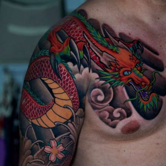 Chest section of a Japanese-style color tattoo by Frank Tattoo Arts